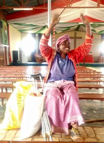 Rwanda - A grateful lady from the church with her supplies.